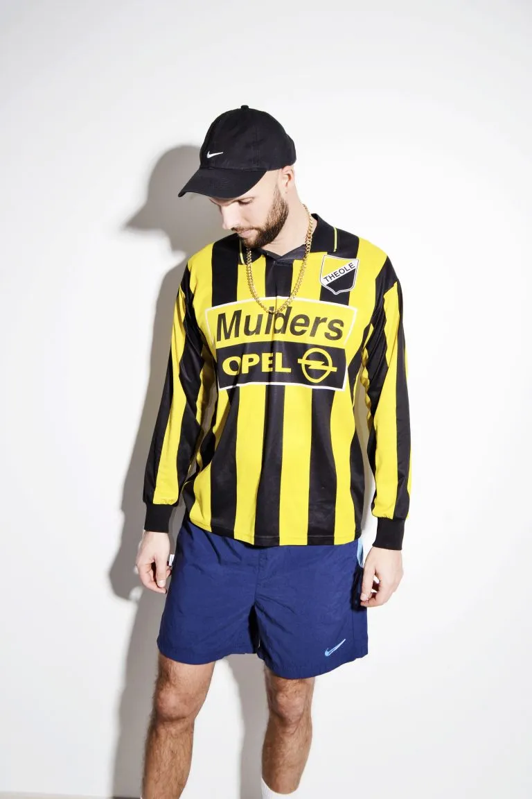 Striped soccer yellow black shirt for men with Opel logo